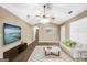 Bright living room featuring wood floors, vaulted ceilings, and a ceiling fan at 130 Nicki Ct, Hampton, GA 30228