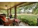 Spacious covered porch with comfortable seating and open field view at 1024 Bethany Rd, Covington, GA 30016