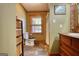Rustic bathroom with slate floors and wood vanity at 1024 Bethany Rd, Covington, GA 30016