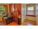 Cozy sitting area with recliner, window seat, and wooden cabinet at 1024 Bethany Rd, Covington, GA 30016