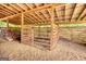 Spacious wooden stable with multiple stalls and a dirt floor at 1024 Bethany Rd, Covington, GA 30016