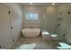 Spa-like bathroom with a freestanding tub and walk-in shower at 130 Windchime Way # 9, Tyrone, GA 30290