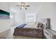 Bright bedroom featuring a comfortable bed and large art piece at 11275 Houze Rd, Roswell, GA 30076