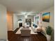 Bright living room features a fireplace, comfy seating, and hardwood floors at 208 Rankin Cir, Mcdonough, GA 30253