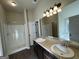 Double vanity bathroom with large mirror and shower at 2299 Church St, Hampton, GA 30228