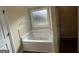 Bathroom features a soaking tub and tile flooring at 2299 Church St, Hampton, GA 30228