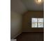 Bedroom with window overlooking houses and street at 2299 Church St, Hampton, GA 30228