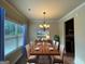 Bright dining room featuring a wood table and modern chandelier at 2299 Church St, Hampton, GA 30228