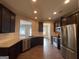 Modern kitchen with stainless steel appliances and granite counters at 2299 Church St, Hampton, GA 30228