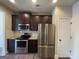 Kitchen boasts stainless steel appliances and granite countertops at 2299 Church St, Hampton, GA 30228