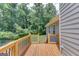 Spacious deck overlooks a private backyard with wooded area at 399 Towler, Loganville, GA 30052