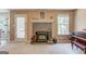 Cozy living room featuring a wood-burning stove and built-in shelving at 399 Towler, Loganville, GA 30052