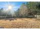 Large backyard with a wood fence line and mature trees at 625 Aya Cir, Loganville, GA 30052