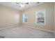 Bedroom features neutral carpet, a ceiling fan and natural light at 625 Aya Cir, Loganville, GA 30052