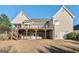 Back exterior of home with large wooden deck at 625 Aya Cir, Loganville, GA 30052