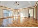 Open-concept living room with hardwood floors and tray ceiling with natural light at 625 Aya Cir, Loganville, GA 30052