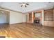 Bright and airy living room features hardwood floors, a fireplace, and built-in shelving at 625 Aya Cir, Loganville, GA 30052