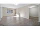Bright living room showcasing a built-in bench, laminate floors and a large window at 625 Aya Cir, Loganville, GA 30052