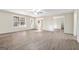 Inviting living room featuring laminate floors and natural light from a large window at 625 Aya Cir, Loganville, GA 30052