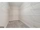 Walk-in closet with wall-mounted shelving for optimal storage at 625 Aya Cir, Loganville, GA 30052