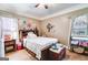 Bedroom featuring wood flooring, ceiling fan, and decorative wall art at 50 Persian Pl, Whitesburg, GA 30185