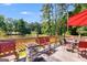 Well-appointed deck with outdoor furniture and a view of the lake for enjoying peaceful surroundings at 50 Persian Pl, Whitesburg, GA 30185