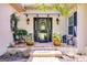 Charming front porch with brick steps, potted plants, and elegant black sconces at 50 Persian Pl, Whitesburg, GA 30185