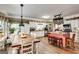 Bright kitchen with white cabinets, island with seating, and stainless steel appliances at 50 Persian Pl, Whitesburg, GA 30185