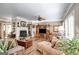 Bright living room with fireplace, wooden floors, and traditional furnishings at 50 Persian Pl, Whitesburg, GA 30185