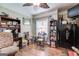 Cozy living room featuring wood-look floors, ceiling fan, and ample storage at 50 Persian Pl, Whitesburg, GA 30185