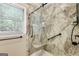 Updated shower stall with glass doors, shower bench, and grab bars at 50 Persian Pl, Whitesburg, GA 30185