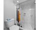 Modern bathroom featuring a glass-enclosed shower with white tiled walls and a toilet at 6 Alston Ne Pl, Atlanta, GA 30324
