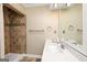 Bright bathroom with a walk-in tiled shower and a vanity with countertop space at 6 Alston Ne Pl, Atlanta, GA 30324
