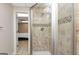 Tiled shower with overhead lighting through glass wall, creating a modern and spa-like experience at 6 Alston Ne Pl, Atlanta, GA 30324