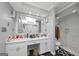 Luxurious bathroom featuring dual sinks, a walk-in shower, and contemporary finishes at 6 Alston Ne Pl, Atlanta, GA 30324
