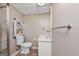Functional bathroom with tile flooring, toilet, vanity, framed mirror and shower, optimizing functionality and convenience at 6 Alston Ne Pl, Atlanta, GA 30324