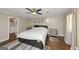 Comfortable bedroom featuring hardwood floors, a ceiling fan, and ample natural light at 6 Alston Ne Pl, Atlanta, GA 30324