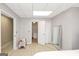 Inviting bedroom with tile flooring, door access, and mirror to add space to the room at 6 Alston Ne Pl, Atlanta, GA 30324