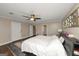 A light-filled bedroom featuring hardwood floors, neutral walls, and modern decor at 6 Alston Ne Pl, Atlanta, GA 30324
