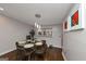 Inviting dining room featuring modern lighting, hardwood floors, and stylish decor creating an ideal atmosphere at 6 Alston Ne Pl, Atlanta, GA 30324