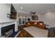 Expansive living room features a fireplace, fan, and modern decor, seamlessly blending comfort and elegance at 6 Alston Ne Pl, Atlanta, GA 30324
