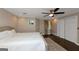 Comfortable bedroom boasts ceiling fan, natural light, hardwood floors, and closet space for relaxing and private space at 6 Alston Ne Pl, Atlanta, GA 30324