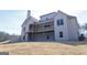 Exterior view of the back of the home with a two-level deck and a large yard with privacy at 5480 Two Hills Dr # 31, Fairburn, GA 30213
