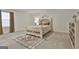 Serene bedroom featuring a decorative bed frame and patterned rug at 5480 Two Hills Dr # 31, Fairburn, GA 30213