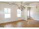 Bright dining room with coffered ceilings, hardwood floors, and elegant lighting at 5480 Two Hills Dr # 31, Fairburn, GA 30213