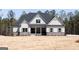 Charming home showcasing gray siding, stone accents, and a welcoming front porch at 5480 Two Hills Dr # 31, Fairburn, GA 30213