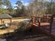 Spacious deck overlooks a gazebo and in-ground pool at 55 Gill Ln, Stockbridge, GA 30281