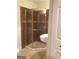 This updated bathroom features tile floors and a glass enclosed shower at 55 Gill Ln, Stockbridge, GA 30281