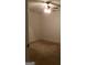 This spacious bedroom has neutral-colored walls and carpeting and a ceiling fan with light fixture at 55 Gill Ln, Stockbridge, GA 30281
