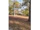 Traditional brick home with mature trees and fall foliage at 55 Gill Ln, Stockbridge, GA 30281